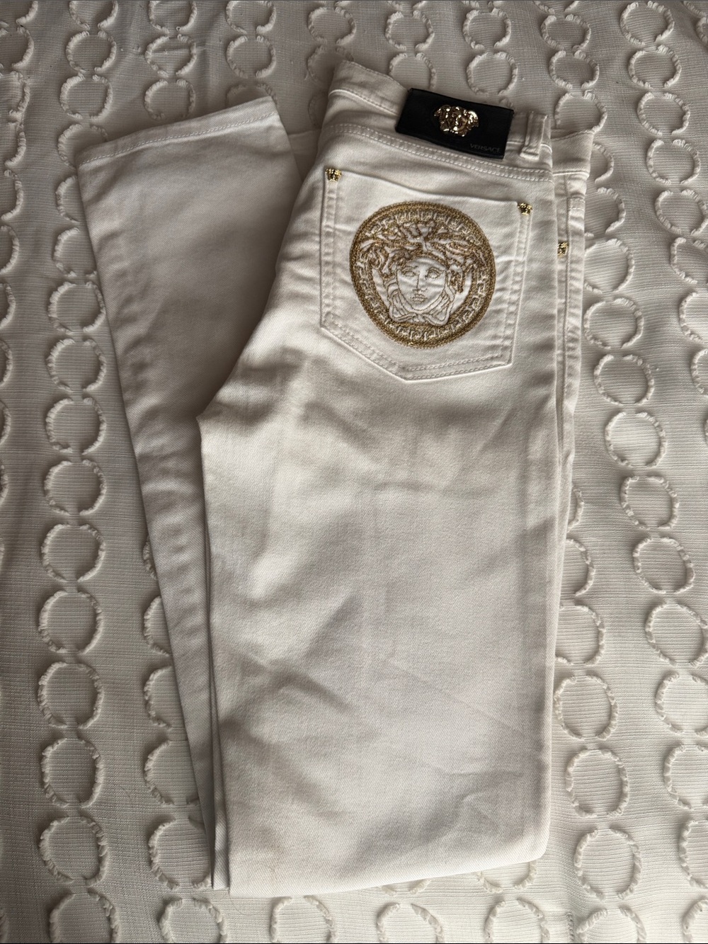 Versace Cream Skinny Jeans with Gold Medallion Detail